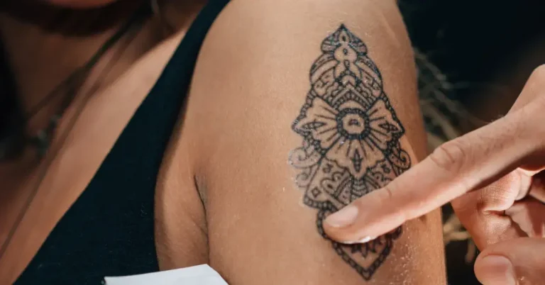 30 Spiritual Tattoos You Will Love 2025 117 spiritual tattoos: a woman gets a a tattoo.