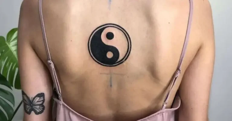 20+ Yin Yang Tattoo You Need To Know 2025 106 Yin Yang Tattoo: a woman has a yin yang tattoo on her back