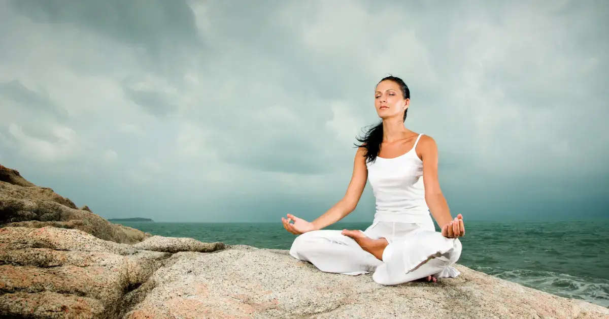 Catholic Meditation: Embracing Silence for Spiritual Growth 2024 1 Catholic Meditation: a woman sit on the beach and mediate