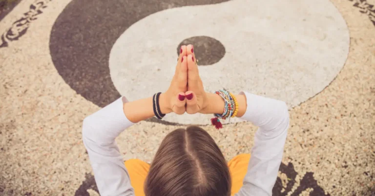 8 Meditation Hand Signs You Must Know 2024 3 Meditation Hand Signs: a woman is sitting an shows Meditation Hand Signs