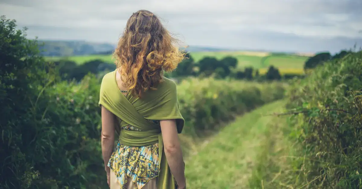 Walking Meditation: a woman is outside and make a walk meditation