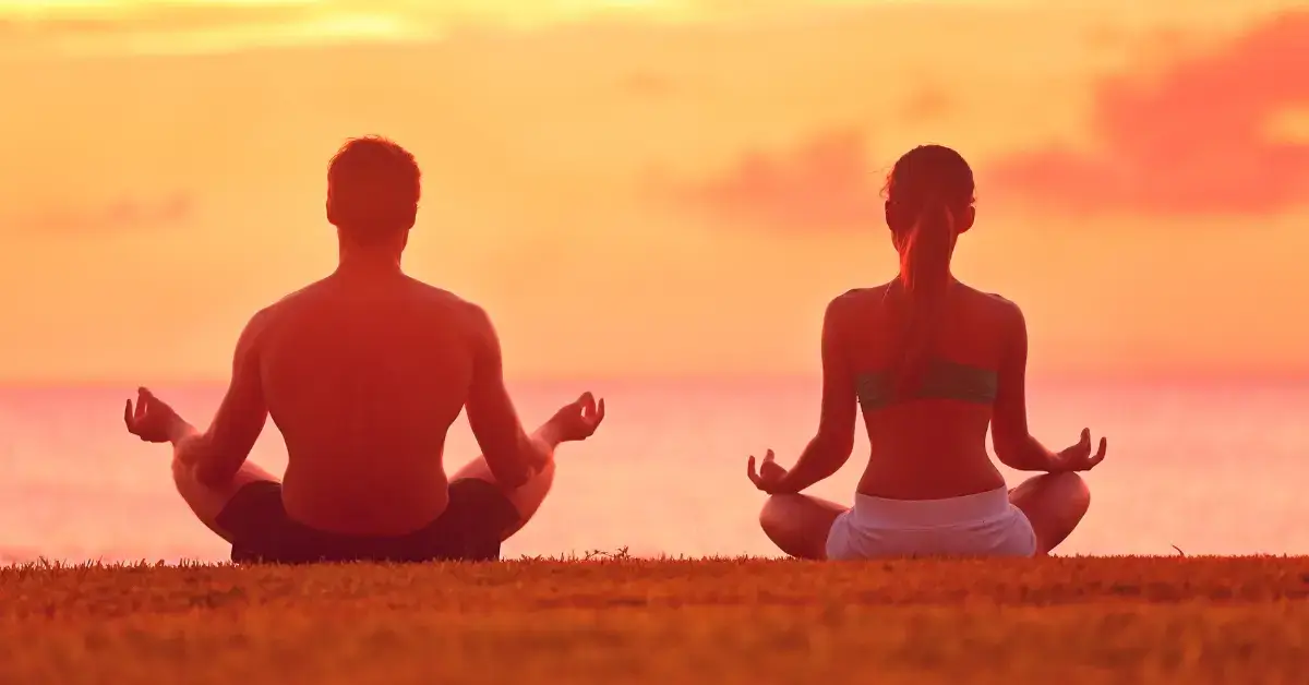 couples meditation: a couple is sitting and mediate together