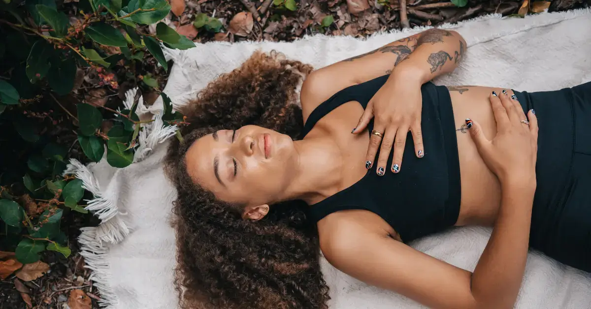 Grounding Meditations: Quick Techniques for Inner Peace 2024 1 grounding meditations: a woman lie on the ground and mediate