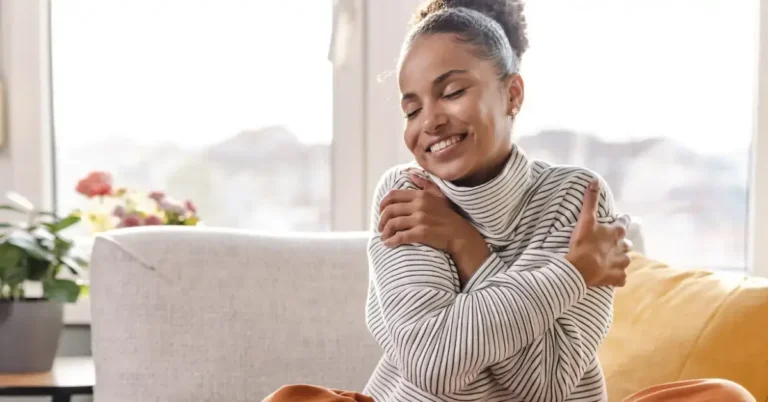 Meditation for Self-Love: Enhancing Your Inner Journey 2024 2 meditation for self-love: a person hugs herself and is laughing