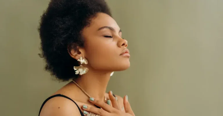 Meditation For Anxiety And Depression: Simple Techniques 2024 1 Meditation for Anxiety and Depression: a woman mediate, had her hands at her chest.