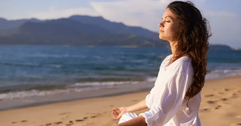 Meditation For Inner Peace And Happiness: Your Guide 2024 1 Meditation for Inner Peace and Happiness: a woman is sitting on the beach and mediate.