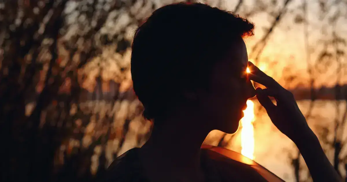 How Long Does It Take To Open Your Third Eye: a man holds his hand in the face
