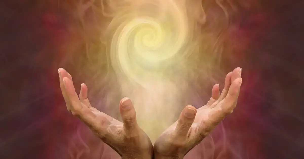 White Aura: two hands hold yellow energy