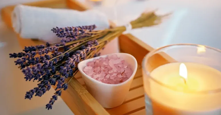 How To Take A Spiritual Bath: Steps For Inner Peace 2024 7 How To Take A Spiritual Bath: lavender and candles lie on the bathtub in a bowl
